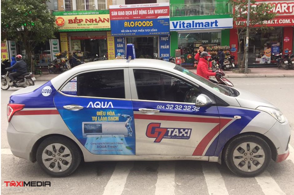 quảng cáo trên xe taxi g7